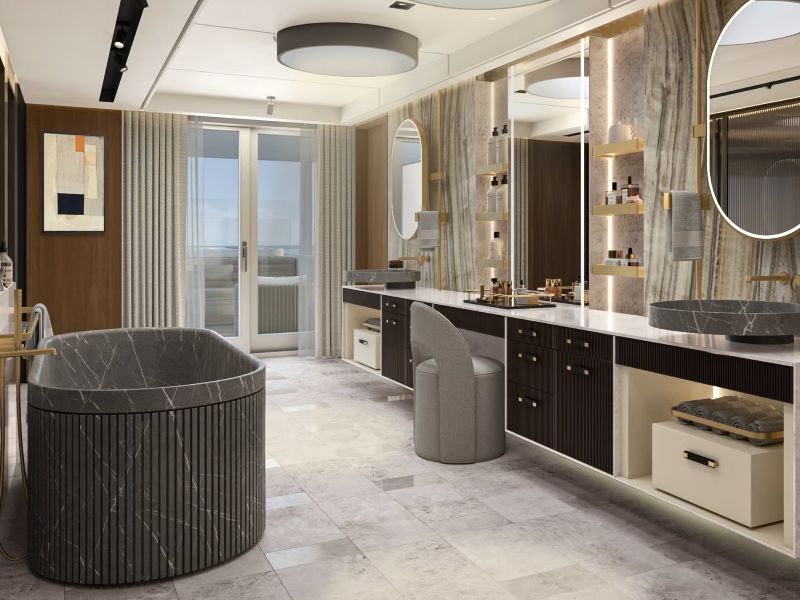 Badkamer in de Skyview Regent Suite met marmeren details en groot ligbad