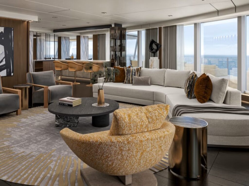 Lounge van de Skyview Regent Suite met uitzicht op zee en elegante inrichting